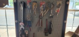 Wall lot of hand tools, vise grips, pipe
