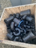 Bin of miscellaneous ABS plumbing fittings