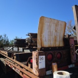 Step deck trailer on upper lot