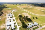 Tract 1: 30.8 Acres - Houses, Barns, Maintenance Bldg, Efficiency Apartments, Arenas & Turnouts
