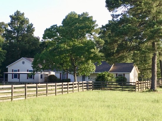 Tract 1: 10.2 acres with Main House and Guest House among mature trees and lush pastures