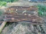 STACK OF METAL FENCE POSTS