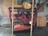 (4) CHAINSAWS ON WOODEN RACK (2) CASES