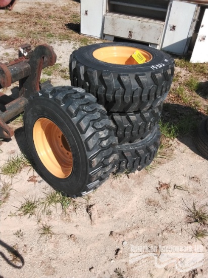 (4) NEW 12-16.5 TIRES ON WHEELS FOR NH/JD/CAT