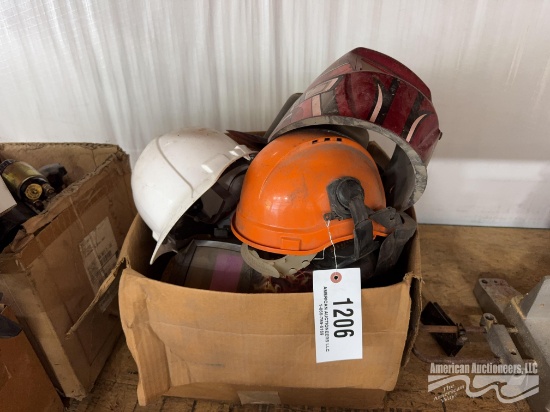 Box of Welding Helmets, Hard Hats, and Face Guards