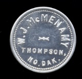 Thompson, ND ... W. J. McMenamy ... Good for 25 Cents Old Token