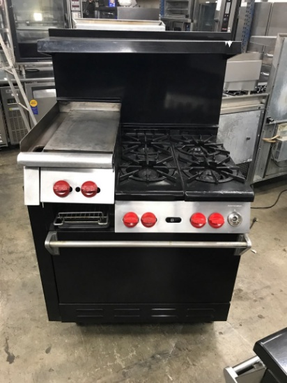 WOLF 4 BURNER/ 12" GRIDDLE/ BROILER & OVEN BELOW