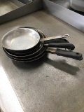 lot of frying pans