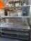 Wells 62 1/2” x 28 1/2” Heavy Duty S.S Worktable w/ Hot Food Well, built-in & Shelving