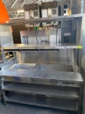 Wells 62 1/2” x 28 1/2” Heavy Duty S.S Worktable w/ Hot Food Well, built-in & Shelving