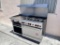 Wolf Combination Gas Range 6 Burners,  24” Griddle, 1 Oven Below & Salamander