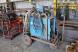 MILLER CP-300 WELDER W/HOSE, MILLER WIRE FEEDER ON METAL ROLLING CART (S/N KD460418, VOLTS 200/230/4