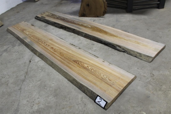 Lot of two locally salvaged live edge Sinker Cypress slabs; dimensions approximately 2" x 13-15" wid