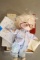 4 Boxes, 2 Catalogs, 1 Doll Baby