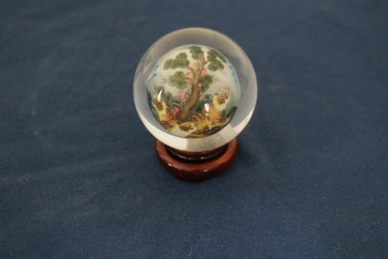 Reverse Painted Glass Ball On Wooden Stand