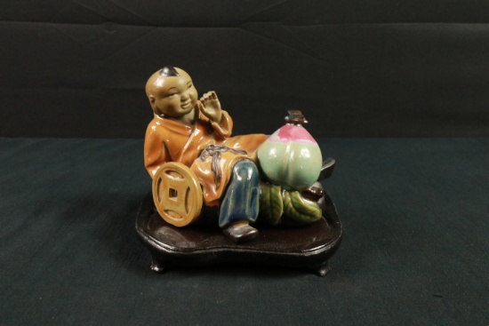 Asian Figurine on Stand