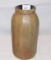 POTTERY VASE BROWN IN COLOR, CHIP ON THE LIP MEASURES 9 1/2