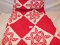 HAND MADE QUILT RED & WHITE IN COLOR, MEASURES APPROXIMATELY  74