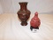 2 VASES; 1 HAS AN ORIENTAL SCENE WITH MAN CARRYING ITEMS ON SHOULDER AND AN