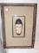 SHADOW BOX WITH A FACE INSIDE THAT LOOKS LIKE A MONKEY MEASURES26 1/4