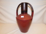 WATER PITCHER, DOUBLE HANDLED, CERAMIC GLAZED MAROON AND BLACK. SOME PITTIN