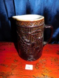 POTTERY WATER PITCHER, BROWN COLOR WITH GRAPE DESIGN, STAR MARKING ON THE B