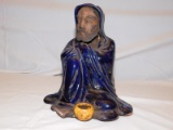 ORIENTAL MAN FIGURINE, SITTING WITH A BOWL ON THE GROUND MEASURES 8