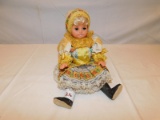 HOLLAND LOOKING DOLL, SLEEPY EYED, SITTING MEASURES 7 1/2