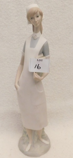 LLADRO, NURSE HOLDING A REPORT.   MEASURES 14" TALL