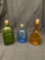 Three antique colored bottles. Cork stoppers.