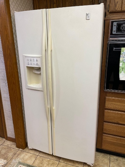 GE Profile white refrigerator with freezer. 25.6 total cubic feet.