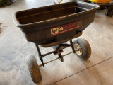 Lawn spreader. Wheels have difficulty turning.