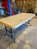 Plastic table with extension legs