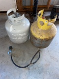 Two propane tanks. Yellow feels full. With adapter.