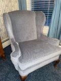 Winged back upholstered living room chair. Blue-gray.