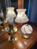 Three lamps and makeup mirror. One lamp is touch activated.