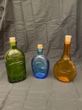 Three antique colored bottles. Cork stoppers.