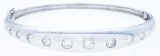 18kt White Gold Custom Made Bangle Bracelet. 15 RB Cut Gypsy Set Diamonds, 1.15ct. SI -G-H Appraisal