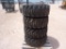 (4) Unused Skid Steer Wheels w/Caterpillar Tires 12-16.5