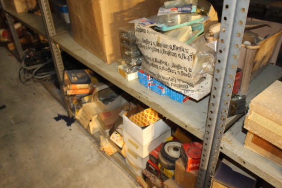 Assortment of various items including rope, screws, nails, light bulbs, bicycle parts and more