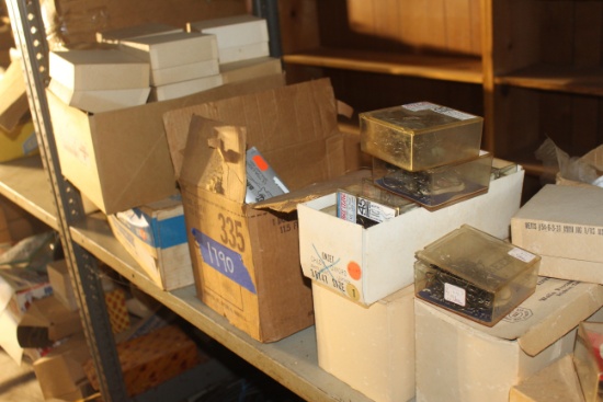 Assortment of various fishing supplies including lures, reels, hooks and more