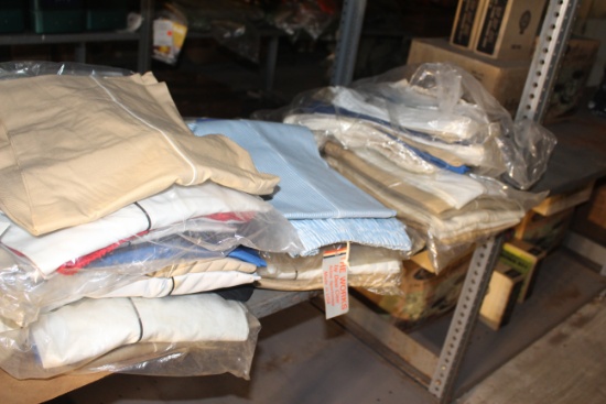 Assortment of various vintage clothes in various styles and sizes including boot socks, pants and bu
