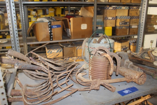 Assortment of vintage hand tools, horse shoes and other vintage iron items