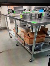 8 FOOT SS TABLE WITH UNDER SHELF AND ON CASTERS