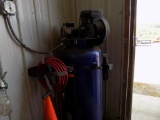 Campbell Hausfield Upright Air Compressor (Inside Shop) with Hose on Reel -