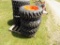 (4) New Camso 10-16.5 Skid Steer Tires on 8-Lug Kubota Rims (4x Bid Price)
