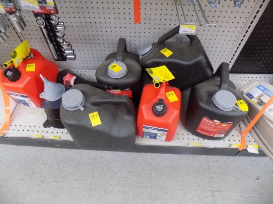 Grp of Oil and Gas Cans on Bottom Shelf