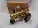 JD Model 730 Tractor ''Gold Paint'' in 1/16 Scale by Ertl.  Some Pitting on