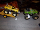 (2) Battery Operated Monster Trucks With Pulling Tractor
