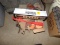 Box of Clay Pigeons, Rifle Scope, and 2 Gun Cleaning Kits